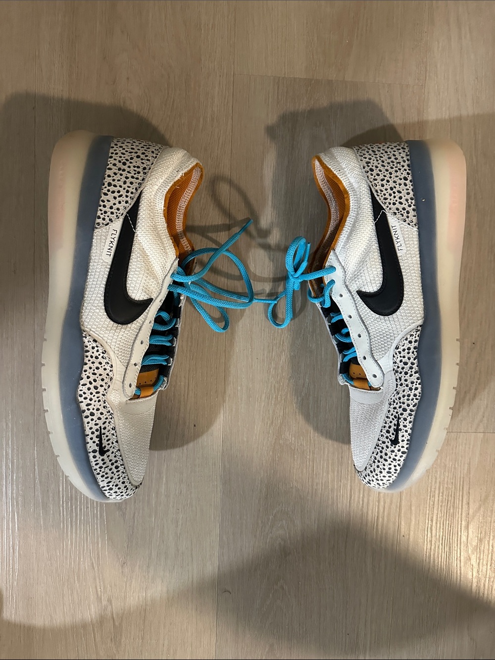 Nike Low-Top Sneakers in White with Black Swoosh and Turquoise Laces